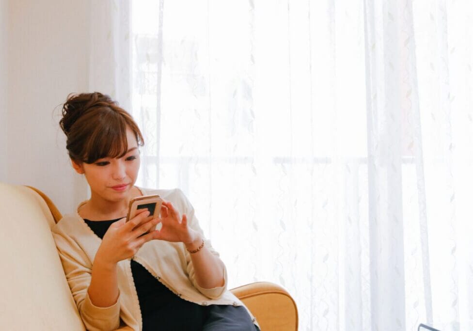 Women on her phone, overthinking her text.